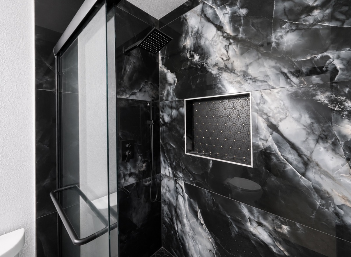 Black marble walk-in shower with rainfall fixture