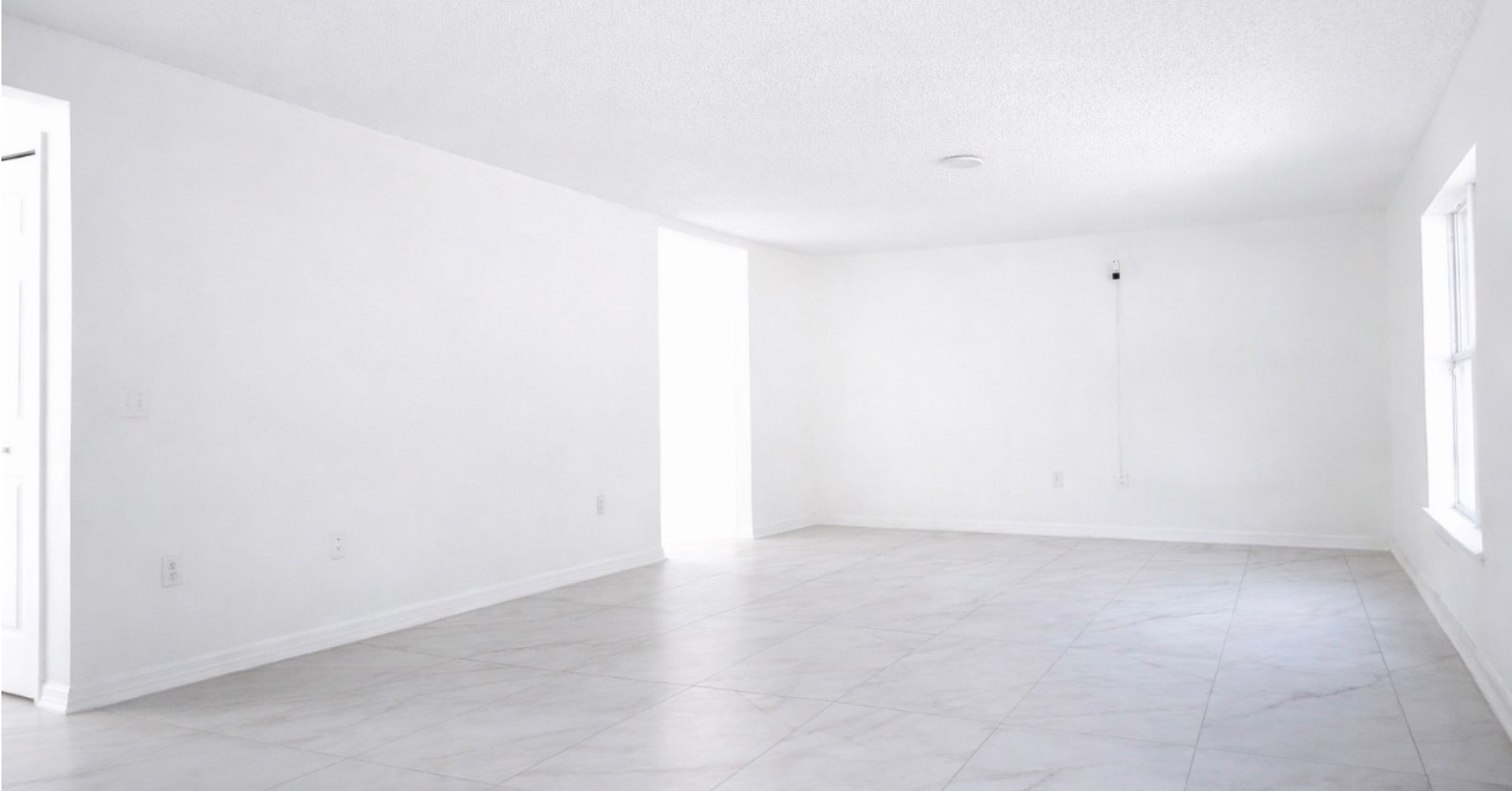 Empty living space with marble tile